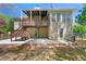 The home's backyard boasts a two-level deck, a patio, and a well-maintained lawn, perfect for outdoor enjoyment at 5445 Mountain Trl, Douglasville, GA 30135