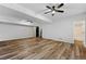 Finished basement with wood-look flooring and access to a full bathroom at 5445 Mountain Trl, Douglasville, GA 30135