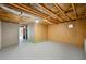 Unfinished basement ready for customization, featuring a concrete floor and visible ceiling insulation at 5445 Mountain Trl, Douglasville, GA 30135