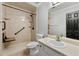 Accessible bathroom featuring a walk-in shower, grab bars, and a built-in shower seat at 5445 Mountain Trl, Douglasville, GA 30135