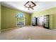 Spacious bedroom with vaulted ceiling, ceiling fan, and large windows at 5445 Mountain Trl, Douglasville, GA 30135