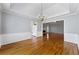 Dining room featuring hardwood floors, detailed wainscoting, and a stylish chandelier at 5445 Mountain Trl, Douglasville, GA 30135