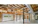 Spacious garage features three bays, concrete flooring, unfinished ceiling, and natural light, offering ample parking and storage at 5445 Mountain Trl, Douglasville, GA 30135