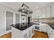 Well-appointed kitchen featuring white cabinets, granite countertops, and stainless steel appliances at 5445 Mountain Trl, Douglasville, GA 30135