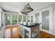 Spacious kitchen with a central island, hardwood floors, and plenty of natural light at 5445 Mountain Trl, Douglasville, GA 30135