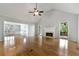 Bright living room with hardwood floors, fireplace, high ceilings, and access to the backyard at 5445 Mountain Trl, Douglasville, GA 30135