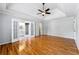 Large main bedroom features wood floors and tray ceiling with a view to the ensuite bathroom at 5445 Mountain Trl, Douglasville, GA 30135