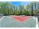 Enjoy a friendly match on these well-maintained tennis courts, surrounded by lush greenery and a serene atmosphere at 5445 Mountain Trl, Douglasville, GA 30135
