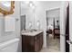 Bathroom with granite counters, framed mirror and natural light at 140 Discovery Lake Dr, Fayetteville, GA 30215