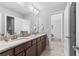 Bathroom featuring double vanity with granite counters, framed mirror and natural light at 140 Discovery Lake Dr, Fayetteville, GA 30215