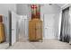 Neutral bedroom with an armoire and doors to multiple rooms at 140 Discovery Lake Dr, Fayetteville, GA 30215