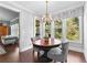 Breakfast nook adjacent to the living room and kitchen, with chandelier and views to the back at 140 Discovery Lake Dr, Fayetteville, GA 30215