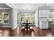 Sunlit dining area with hardwood floors at 140 Discovery Lake Dr, Fayetteville, GA 30215