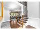 Open foyer with hardwood floors, staircase, and bench at 140 Discovery Lake Dr, Fayetteville, GA 30215