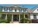 Inviting front porch features stone pillars and a stylish entryway at 140 Discovery Lake Dr, Fayetteville, GA 30215