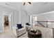 Upstairs loft space with comfortable seating and easy access to other bedrooms at 140 Discovery Lake Dr, Fayetteville, GA 30215