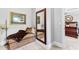 Sitting room that connects to the main bedroom with day bed, accent mirror and light at 140 Discovery Lake Dr, Fayetteville, GA 30215