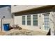 View of backyard with siding, three windows, privacy fence, and an access door at 2004 Burns View Ln, Lawrenceville, GA 30044