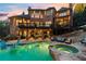 Luxury home with a stunning backyard featuring a pool, hot tub, patio, and outdoor seating area at 2805 Cambria Ct, Cumming, GA 30041
