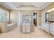 Relaxing bathroom with a large soaking tub, glass shower, and double vanity at 2805 Cambria Ct, Cumming, GA 30041