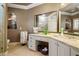 Bathroom featuring granite countertops, dual mirrors, and ample storage at 2805 Cambria Ct, Cumming, GA 30041