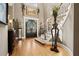 Elegant foyer with a grand staircase, decorative wrought iron, hardwood floors, and stylish decor at 2805 Cambria Ct, Cumming, GA 30041
