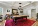 Game room with billiard table, designer lighting and red rug at 2805 Cambria Ct, Cumming, GA 30041