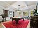 Game room features a billiard table, designer lighting, and windows with outdoor views at 2805 Cambria Ct, Cumming, GA 30041
