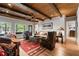 Comfortable living room featuring wood ceilings, large windows and western decor touches at 2805 Cambria Ct, Cumming, GA 30041