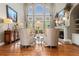 Bright living room with large windows, fireplace, and elegant furnishings at 2805 Cambria Ct, Cumming, GA 30041