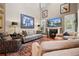 Bright living room with high ceilings, a fireplace, large rug, and comfortable seating area at 2805 Cambria Ct, Cumming, GA 30041