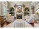 Comfortable living room showcasing a fireplace, built-in cabinets, and stylish decor at 2805 Cambria Ct, Cumming, GA 30041