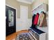 Mudroom featuring a bench with storage, coat hooks, and an ornate front door at 2805 Cambria Ct, Cumming, GA 30041