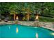 Beautiful pool with fire bowls, cascading water, and stone accents at 2805 Cambria Ct, Cumming, GA 30041