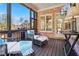 Screened-in porch with outdoor seating, a ceiling fan, and views of the yard at 2805 Cambria Ct, Cumming, GA 30041