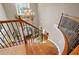 Grand staircase with wooden railings and ornate iron spindles leads to the main level at 2805 Cambria Ct, Cumming, GA 30041