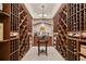 Walk-in wine cellar with custom wood shelving at 2805 Cambria Ct, Cumming, GA 30041