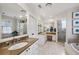 Spacious bathroom featuring marble counters, soaking tub, and glass-enclosed shower at 3114 Peachtree Ne Dr, Atlanta, GA 30305