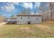The backyard features a spacious yard and a small deck attached to the house at 4251 Klondike Rd, Lithonia, GA 30038