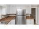 Kitchen with white cabinets and a stainless steel refrigerator at 4251 Klondike Rd, Lithonia, GA 30038