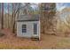 This small shed is the perfect place to store your gardening supplies or outdoor equipment at 4251 Klondike Rd, Lithonia, GA 30038