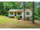 Charming single Gathering home with a cozy front porch and yard at 7281 Fernwood Dr, Riverdale, GA 30296