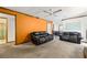 Open living room with bright paint color and access to the dining area at 7281 Fernwood Dr, Riverdale, GA 30296