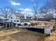 Expansive back exterior featuring a deck, covered patio, and a gazebo overlooking the lake at H-5422 Hill Sw Rd, Powder Springs, GA 30127