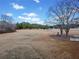 Spacious backyard surrounded by mature trees, providing a serene and private outdoor setting at H-5422 Hill Sw Rd, Powder Springs, GA 30127