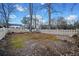 Backyard with a charming picket fence and a lush, green lawn, perfect for Gathering activities at H-5422 Hill Sw Rd, Powder Springs, GA 30127