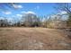 Expansive backyard leading to the waterfront, showcasing natural beauty and serenity at H-5422 Hill Sw Rd, Powder Springs, GA 30127