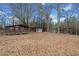 Spacious backyard with multiple structures offering a variety of outdoor relaxation and entertainment options at H-5422 Hill Sw Rd, Powder Springs, GA 30127