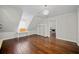 Bedroom features sloped ceilings, hardwood floors and a cozy, bright atmosphere at H-5422 Hill Sw Rd, Powder Springs, GA 30127