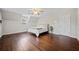 Bedroom features hardwood floors and a sloped ceiling with a window at H-5422 Hill Sw Rd, Powder Springs, GA 30127